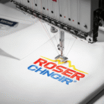 An embroidery machine stitching a digitized logo on a polo shirt